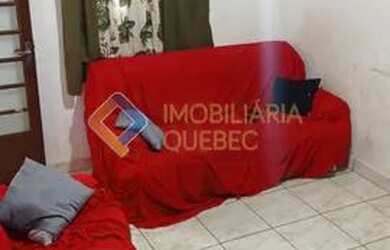 Imagem: A casa possui 2 Dormitórios, 1 Banheiro, 2 Vagas na garagem