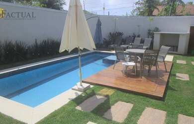 Imagem: A casa possui 5 Dormitórios, 5 Banheiros, 4 Vagas na garagem