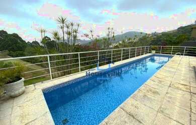 Imagem: A casa em condomínio possui 4 Dormitórios, 4 Banheiros, 4