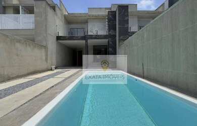 Imagem: A casa possui 3 Dormitórios, 4 Banheiros, 2 Vagas na garagem