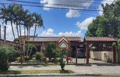 Imagem: A casa possui 2 Dormitórios, 2 Banheiros, 3 Vagas na garagem