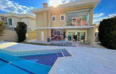 Imagem: A casa em condomínio possui 4 Dormitórios, 5 Banheiros, 4