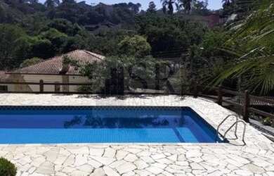 Imagem: A casa possui 3 Dormitórios, 4 Banheiros, 4 Vagas na garagem