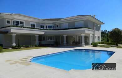 Imagem: A casa em condomínio possui 5 Dormitórios, 5 Banheiros, 4