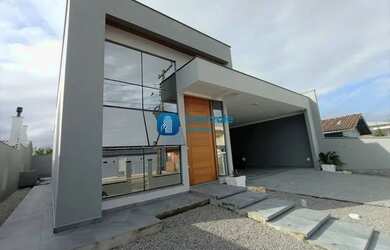 Imagem: A casa possui 2 Dormitórios, 3 Banheiros, 2 Vagas na garagem