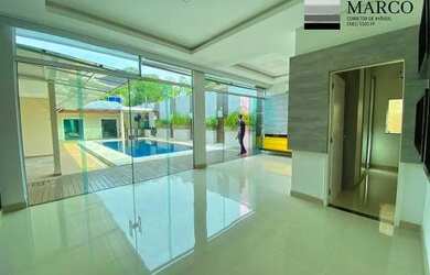 Imagem: A casa possui 3 Dormitórios, 4 Banheiros, 4 Vagas na garagem