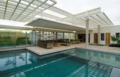 Imagem: A casa em condomínio possui 4 Dormitórios, 5 Banheiros, 4