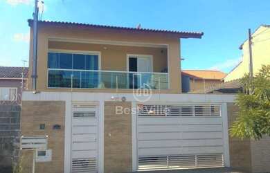 Imagem: A casa possui 3 Dormitórios, 3 Banheiros, 4 Vagas na garagem