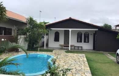 Imagem: A casa possui 3 Dormitórios, 3 Vagas na garagem, Churrasqueira