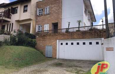 Imagem: A casa em condomínioe possui 3 Dormitórios, 4 Banheiros, 4