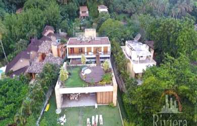 Imagem: A casa possui 5 Dormitórios, 5 Banheiros, 5 Vagas na garagem