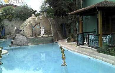 Imagem: A casa possui 5 Dormitórios, 5 Banheiros, 5 Vagas na garagem