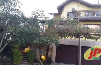 Imagem: A casa em condomínio possui 4 Dormitórios, 3 Banheiros, 2