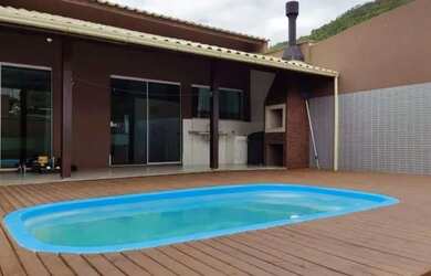 Imagem: A casa possui 3 Dormitórios, 3 Banheiros, 3 Vagas na garagem