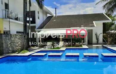 Imagem: A casa possui 5 Dormitórios, 5 Banheiros, 5 Vagas na garagem