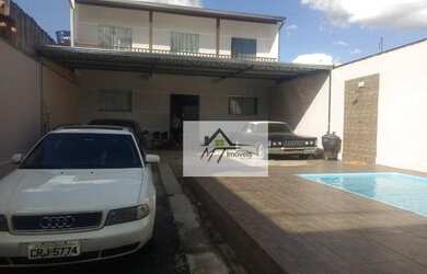 Imagem: A casa possui 4 Dormitórios, 1 Banheiro, 5 Vagas na garagem