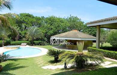 Imagem: A casa em condomínio possui 4 Dormitórios, 5 Banheiros, 5