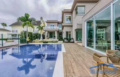 Imagem: A casa em condomínio possui 5 Dormitórios, 5 Banheiros, 4