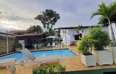 Imagem: A casa possui 4 Dormitórios, 5 Banheiros, 4 Vagas na garagem