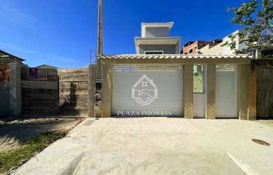 Imagem: A casa possui 3 Dormitórios, 3 Banheiros, 2 Vagas na garagem