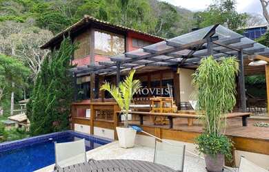 Imagem: A casa em condomínio à venda possui 5 Dormitórios, 5 Banheiros