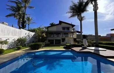 Imagem: A casa possui 5 Dormitórios, 5 Banheiros, 5 Vagas na garagem