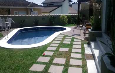 Imagem: A casa em condomínio possui 4 Dormitórios, 5 Banheiros, 4