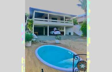 Imagem: A casa possui 5 Dormitórios, 5 Banheiros, 5 Vagas na garagem