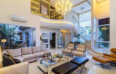 Imagem: A casa possui 3 Dormitórios, 4 Banheiros, 4 Vagas na garagem