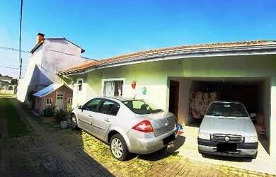 Imagem: A casa possui 3 Dormitórios, 2 Banheiros, 1 Vaga na garagem