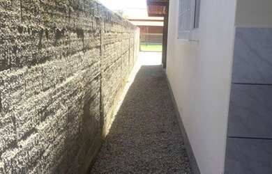 Imagem: A casa possui 3 Dormitórios, 1 Banheiro, 1 Vaga na garagem