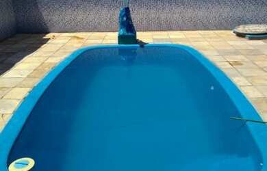 Imagem: A casa possui 2 Dormitórios, 4 Vagas na garagem, Churrasqueira