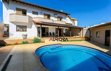 Imagem: A casa possui 5 Dormitórios, 5 Banheiros, 4 Vagas na garagem