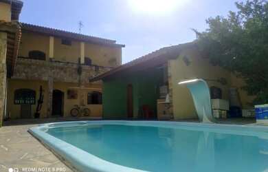 Imagem: A casa possui 3 Dormitórios, 4 Banheiros, 4 Vagas na garagem