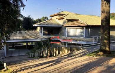 Imagem: A casa em condomínio possui 5 Dormitórios, 5 Banheiros, 5