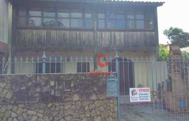 Imagem: A casa possui 3 Dormitórios, 2 Banheiros, 1 Vaga na garagem