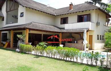 Imagem: A casa em condomínio possui 4 Dormitórios, 5 Banheiros, 5