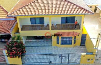 Imagem: A casa possui 4 Dormitórios, 5 Banheiros, 5 Vagas na garagem