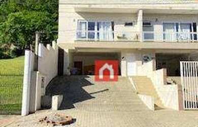 Imagem: A casa possui 3 Dormitórios, 3 Banheiros, 2 Vagas na garagem