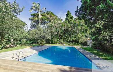 Imagem: A casa em condomínio possui 4 Dormitórios, 4 Banheiros, 2