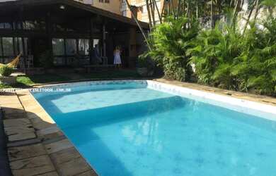 Imagem: A casa possui 5 Dormitórios, 5 Banheiros, 4 Vagas na garagem