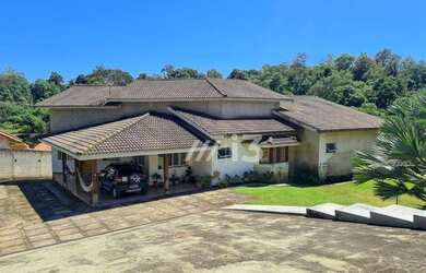 Imagem: A casa em condomínio possui 4 Dormitórios, 4 Banheiros, 5