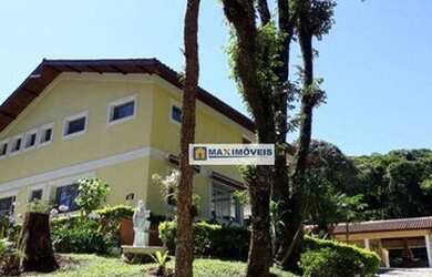 Imagem: A casa possui 4 Dormitórios, 5 Banheiros, 5 Vagas na garagem