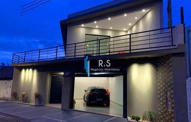 Imagem: A casa possui 3 Dormitórios, 3 Banheiros, 2 Vagas na garagem