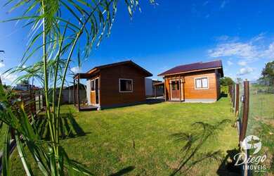 Imagem: A casa possui 3 Dormitórios, 1 Banheiro, 3 Vagas na garagem