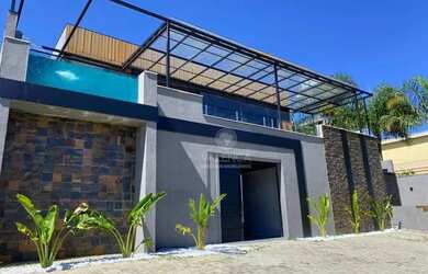 Imagem: A casa em condomínio possui 5 Dormitórios, 5 Banheiros, 5