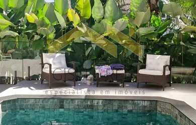 Imagem: A casa possui 3 Dormitórios, 5 Banheiros, 2 Vagas na garagem