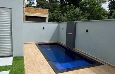 Imagem: A casa em condomínio possui 4 Dormitórios, 4 Banheiros, 2