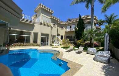 Imagem: A casa em condomínio possui 5 Dormitórios, 5 Banheiros, 4