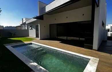 Imagem: A casa em condomínio possui 4 Dormitórios, 5 Banheiros, 5